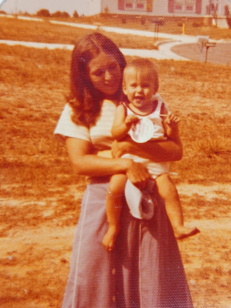 Mother holding child.